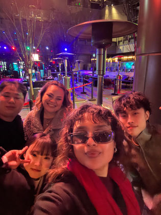 Friends having fun in Tokyo at night