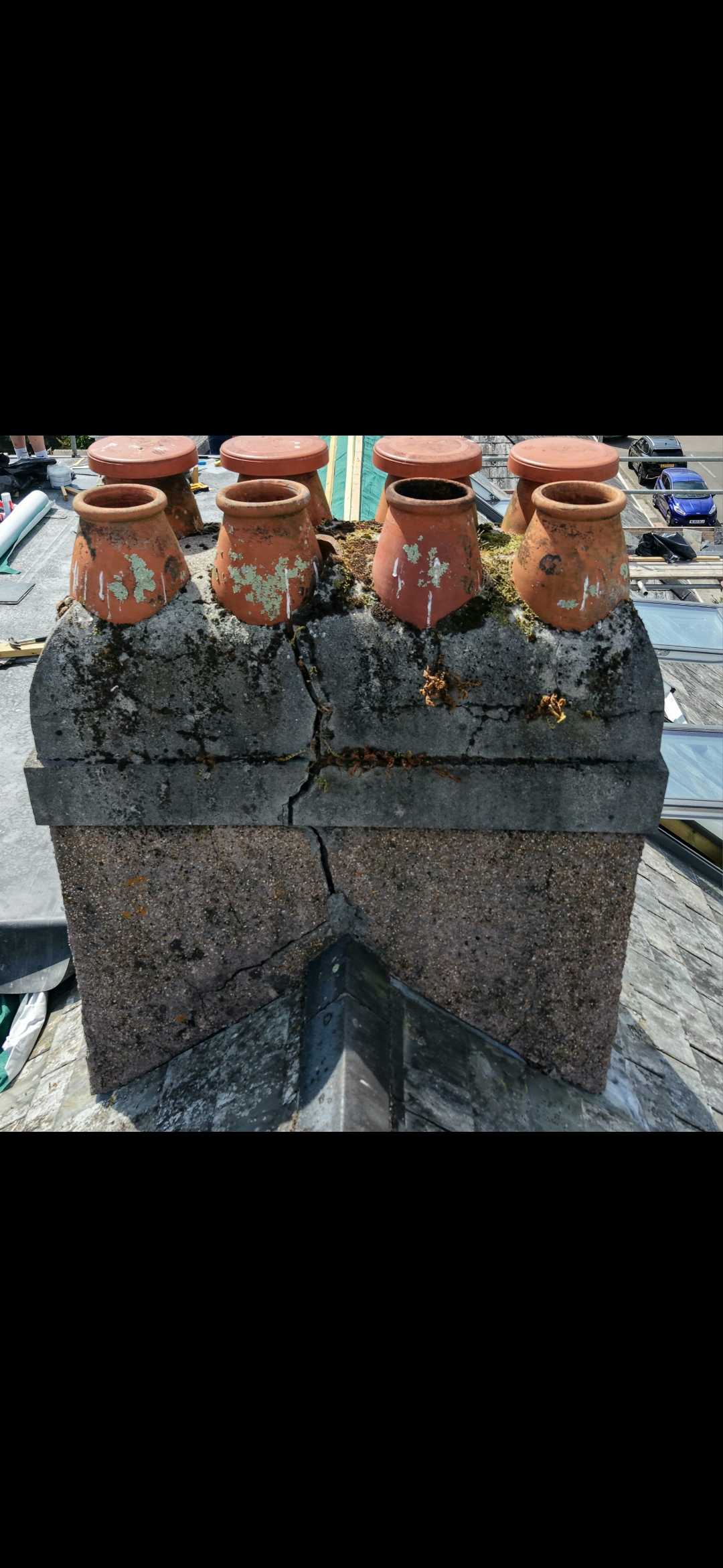 Chimney pots and roof junction recorded during a survey