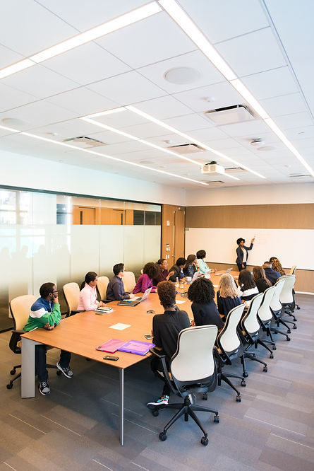 Photo Of People Leaning On Table