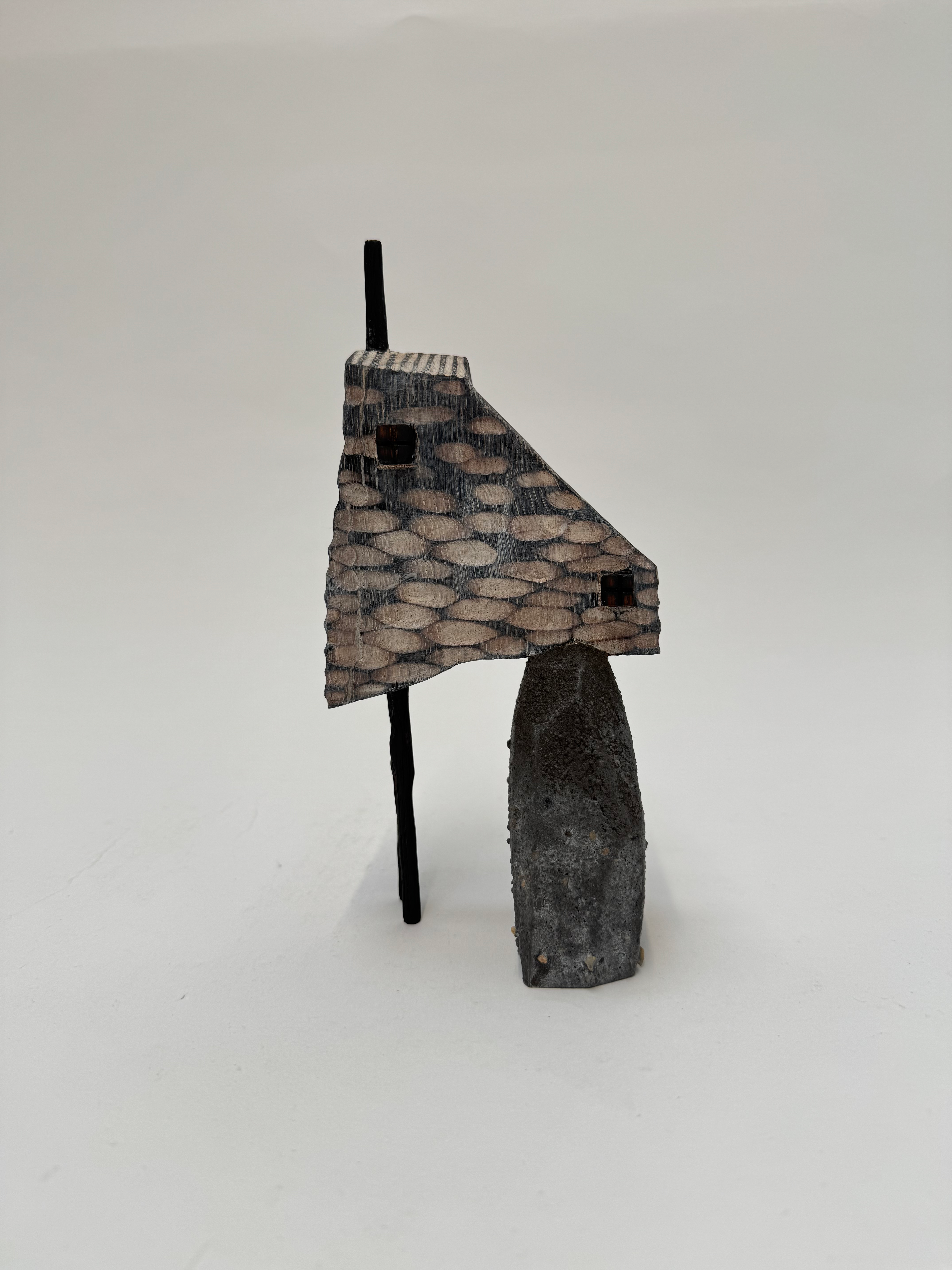 Cottage balancing on a rock