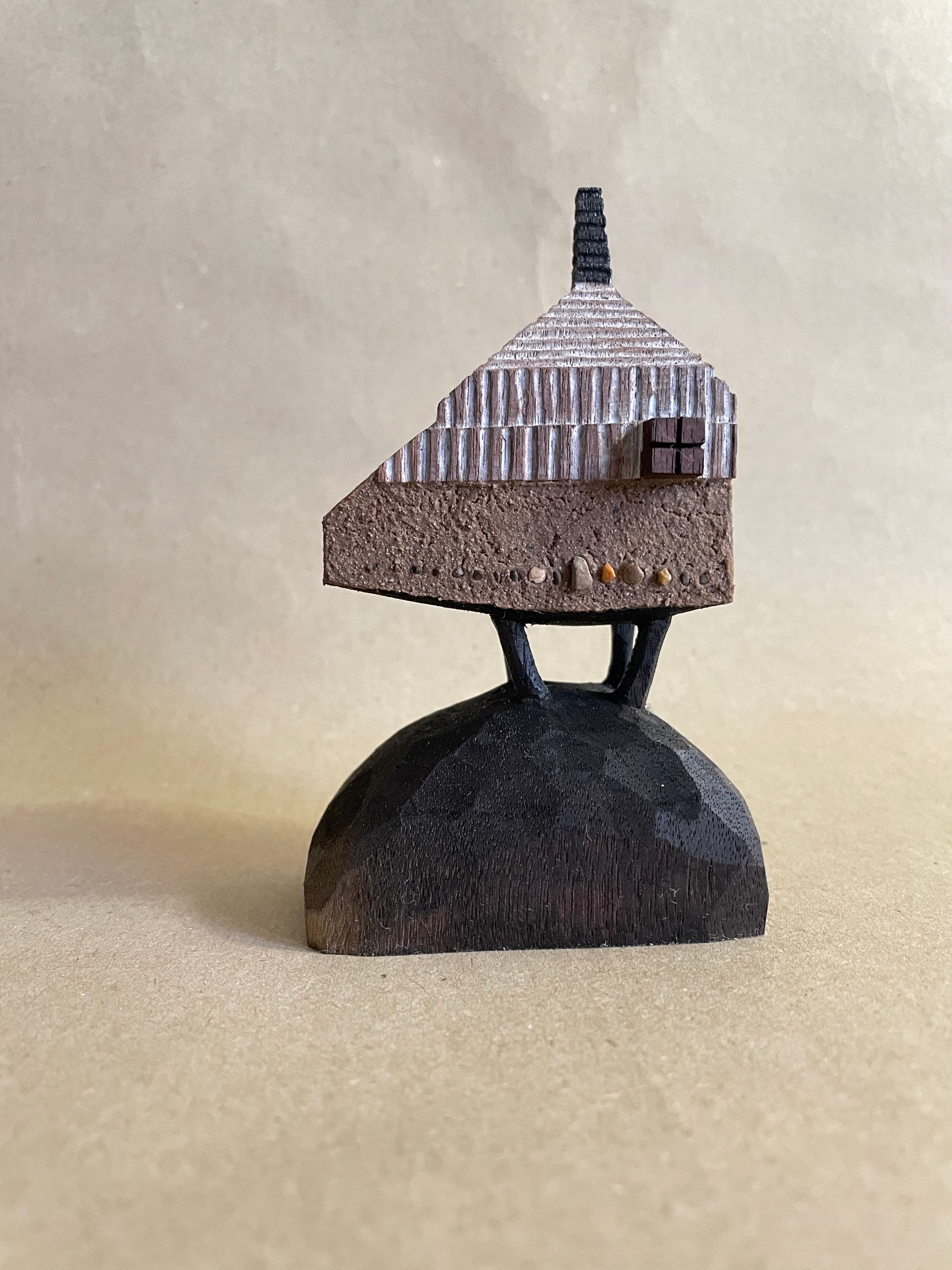 Little mudwall house on boulder