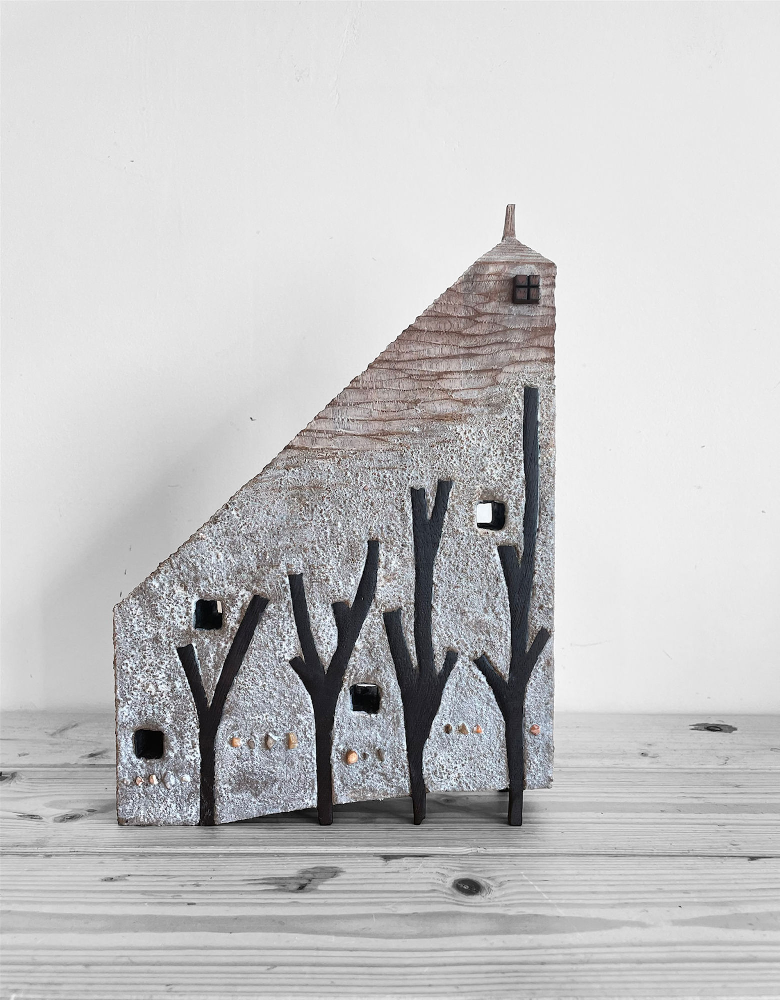 Wall house in the branches