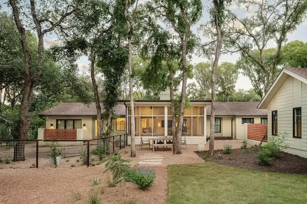 Home exterior surrounded by trees
