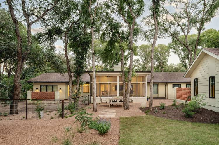 Home exterior surrounded by trees