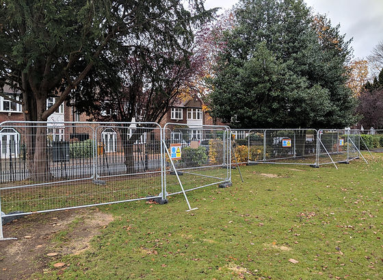 Secure fence around a park, preserving trees as part of a Tree Protection Plan.