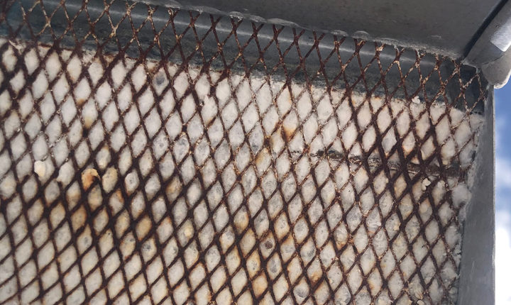 Clogged exterior vent screen blocking dryer airflow