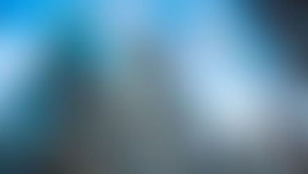 A plane flies over skyscrapers