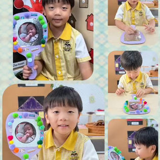 A child proudly presents a creative mirror craft in a fun classroom setting.