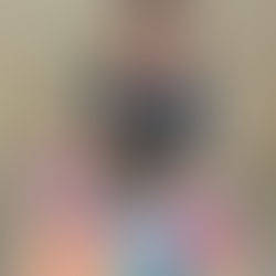 A baby playing with balloons