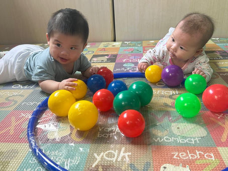Little ones exploring colors and sensory ball play together! 🌈🧸