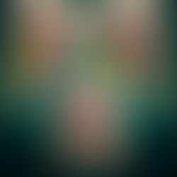 A young child happily creates a star-themed craft using colorful materials.