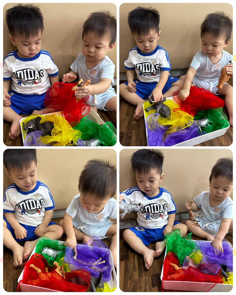 Children explore colorful fabrics and animal toys through sensory play together.