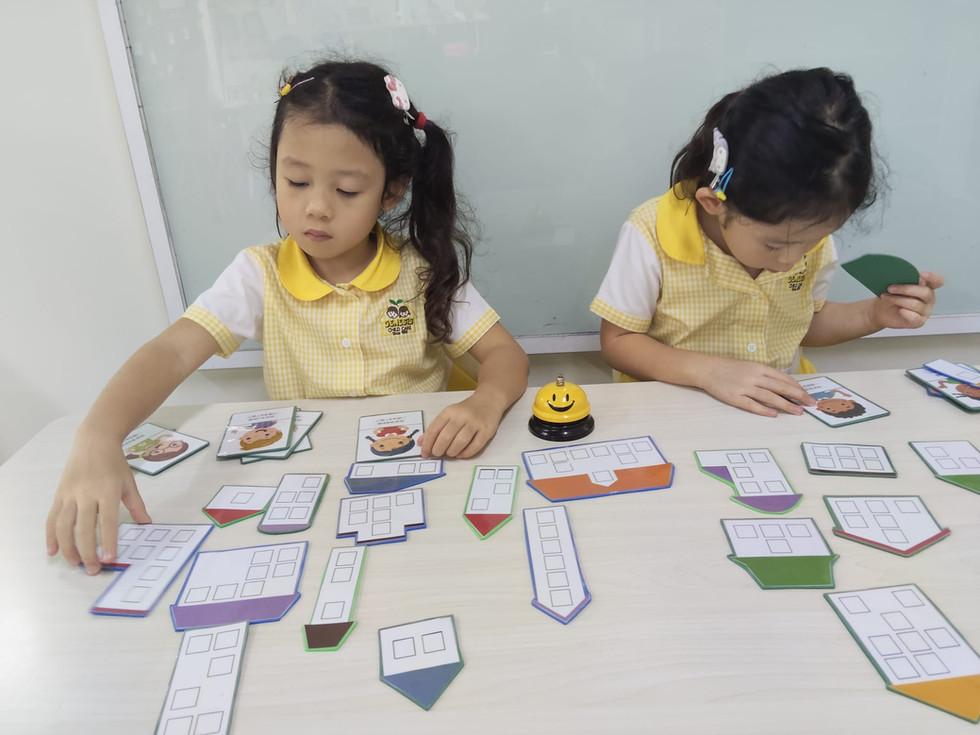 Children learning number recognition through a fun matching activity.