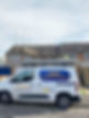 Tony's Roofing and Guttering Services van parked outside a house with scaffolding on the roof