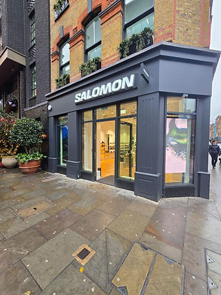 The outside of a shop with a timber shop front.