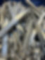A heap of shiny metal scraps, featuring long, flat, and crumpled pieces
