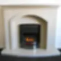 Electric fire with orange flames and a coal bed housed in a white arched fireplace suite