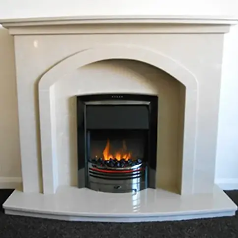 Electric fire with orange flames and a coal bed housed in a white arched fireplace suite