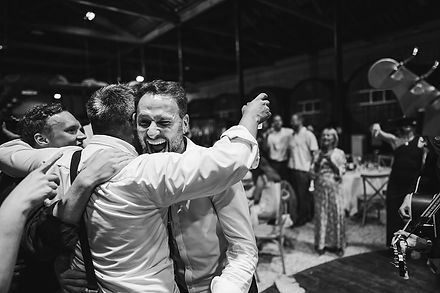 Guests dancing outside as the wedding celebration moves into the night