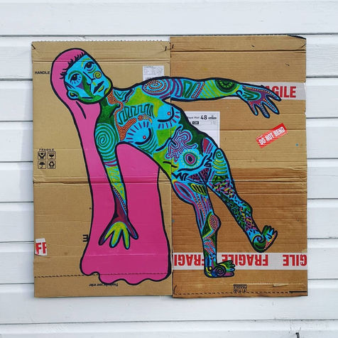 Acrylic paint on cardboard, 60 cm by 60 cm. A blue human figure with pink fringe and long pink hair. The character has multi-coloured patterns across its body and face and a thick dark black outline separates it from the brown cardboard background. "Fragile" tape crosses the cardboard.