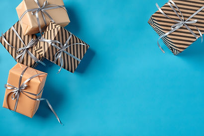 colorful-striped-plain-brown-pink-paper-gift-boxes-tied-with-silver-ribbons-bows-bl.jpg