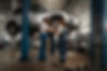 male-female-mechanics-working-shop-car.jpg