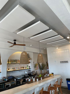 Pub bar with acoustic ceiling panels