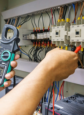 electrical-engineer-adjusts-electrical-equipment-with-multimeter-tester-his-hand.jpg