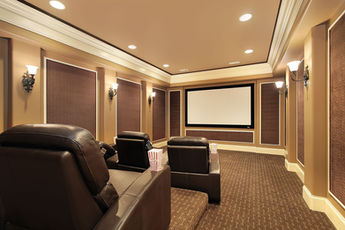 Home Theater with decorative acoustic treatment including fabric system ceiling and wall panels