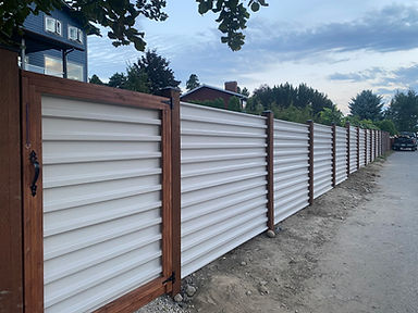 Corrugated back side with stained posts.jpeg