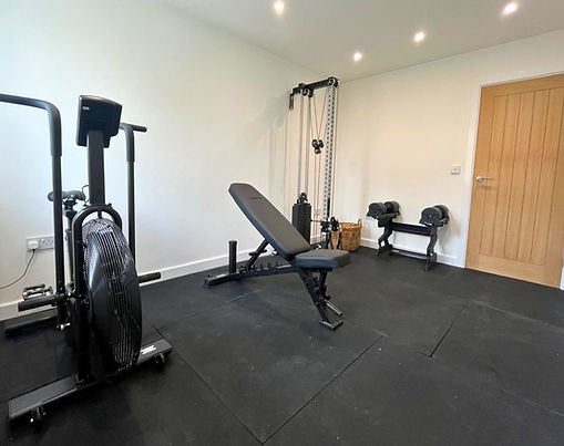 Converted garage interior — home gym and utility room, Sandbach, Cheshire