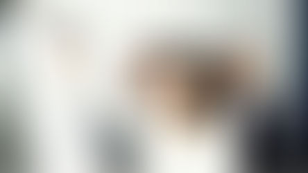 A group of people looking at a paper, graphing business metrics