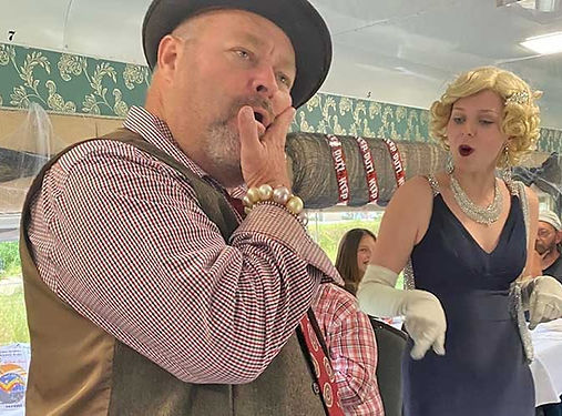 performers-arguing-in-dining-area-of-train-at-murder-mystery-dinner-train-fort-myers.jpg