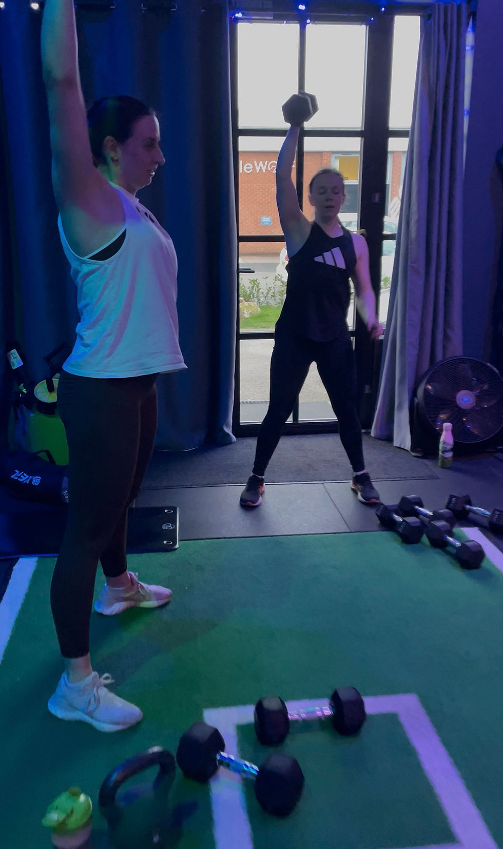 High angle view of a group HYROX training session in a gym