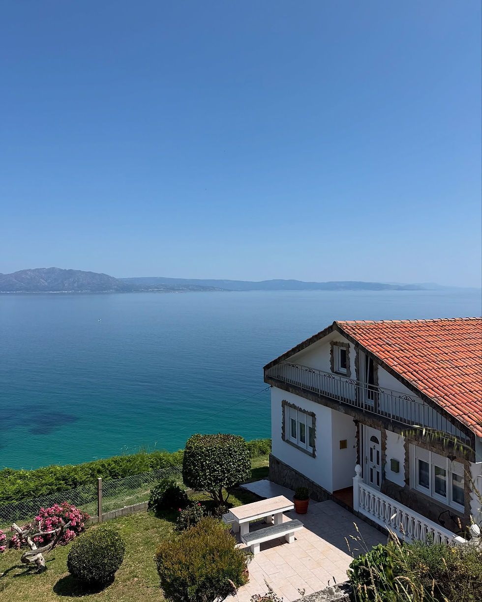 A couple on the camino de Santiago walking with hiking poles and backpacks.jpg