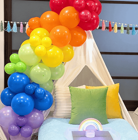 Rainbow balloon garlands are a show stopper for any tent but especially on the Over the Rainbow dream setup for kids. 