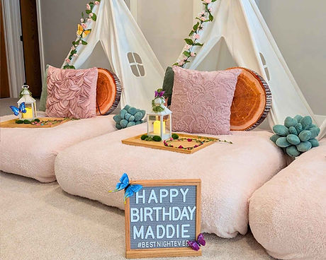 A magical fairy forest enchanted slumber party setup feauring blush, sage and woodland accents.