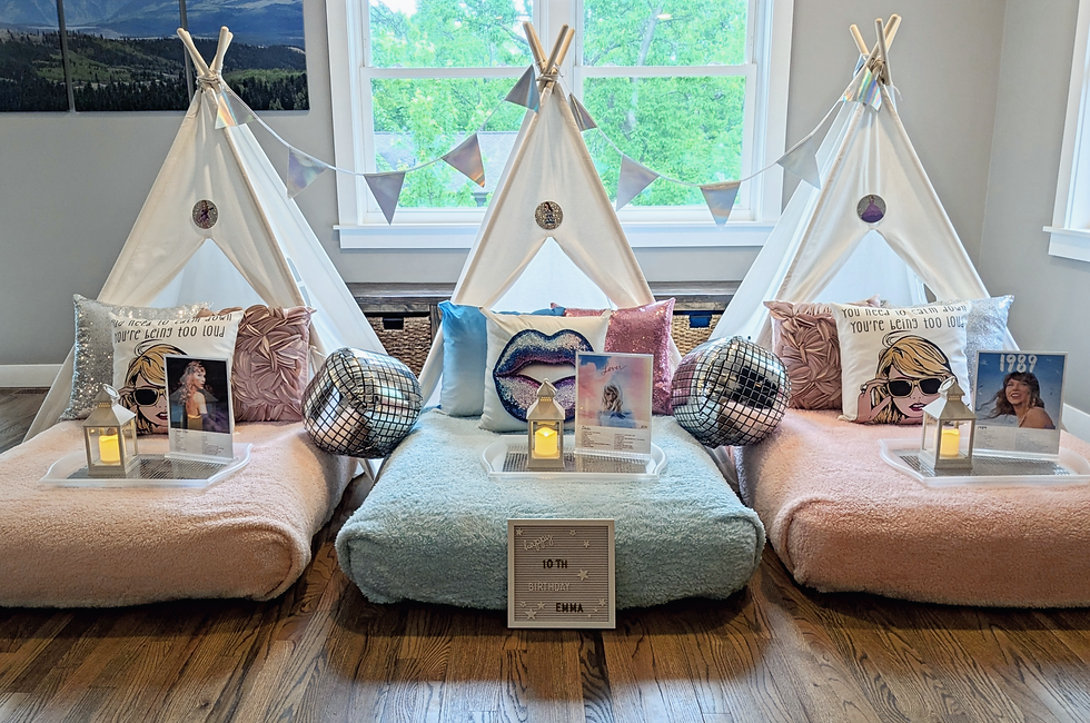 Dream Away Soirée teepees with cushions, disco balls, and lanterns on trays in a room. Birthday sign reads: "10th Birthday Emma." Bright window view.