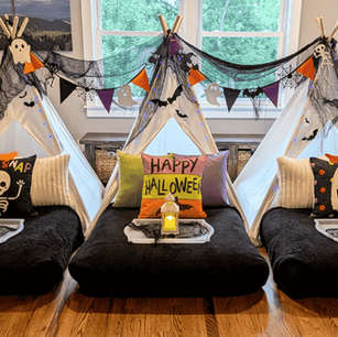 Spooky and playful kids Halloween teepee sleepover setup featuring the Boo! theme by Dream Away Soirée.