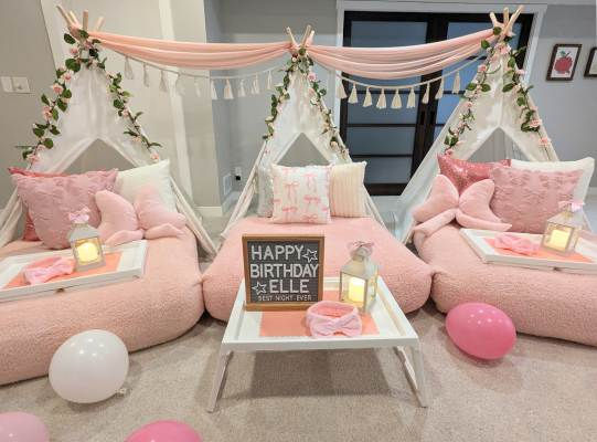 Blush tones, bow pillows, and cozy tents make this setup sweet, stylish, and oh-so-girly. Ideal for