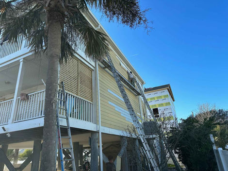 The siding of the exterior of the house is yellow mustard color before remodeling.