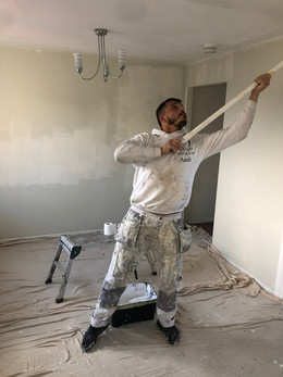 Applying wallpaper over paint