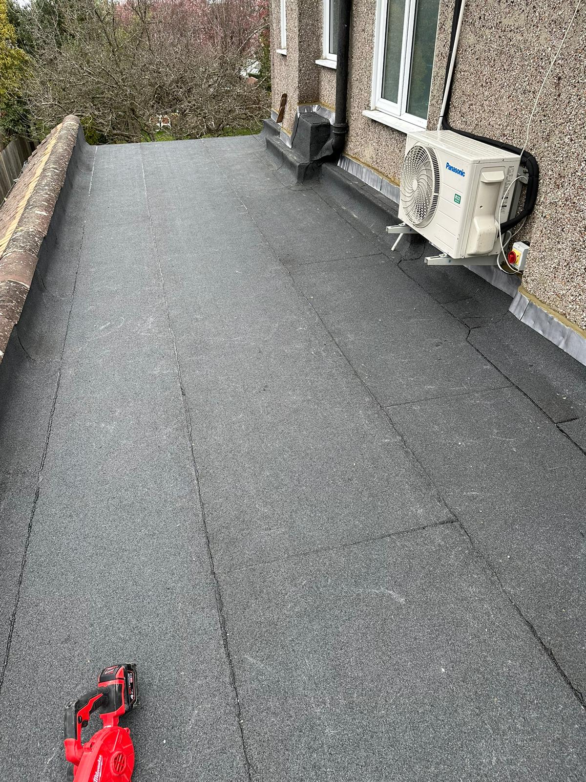 wh-roofing-grey-flat-roof-beside-brick-building-wall-34