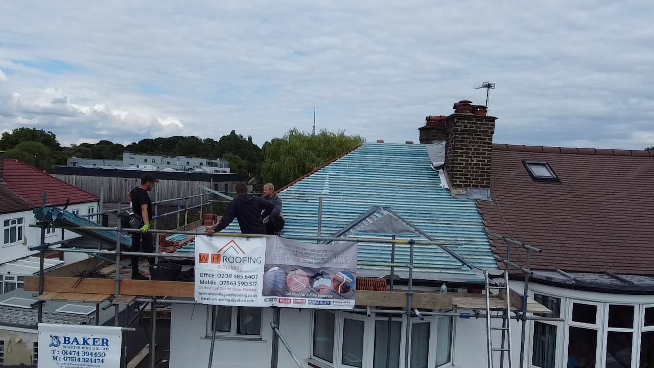 wh-roofing-roof-replacement-project-with-scaffolding-and-roofers-36.jpg