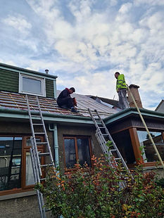 Roofers working on a roofing project