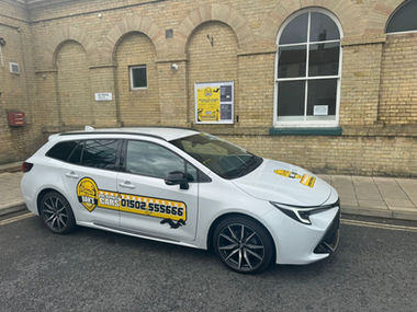 Taxi outside a building