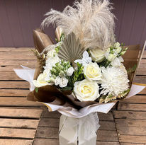 White and cream themed flower bouquet with white roses
