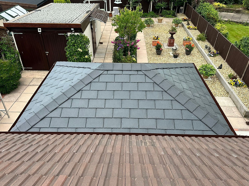 Roof repairs with grey slate tiles in progress