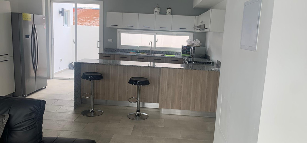 A fully furnished home with three spacious bedrooms and modern decor.