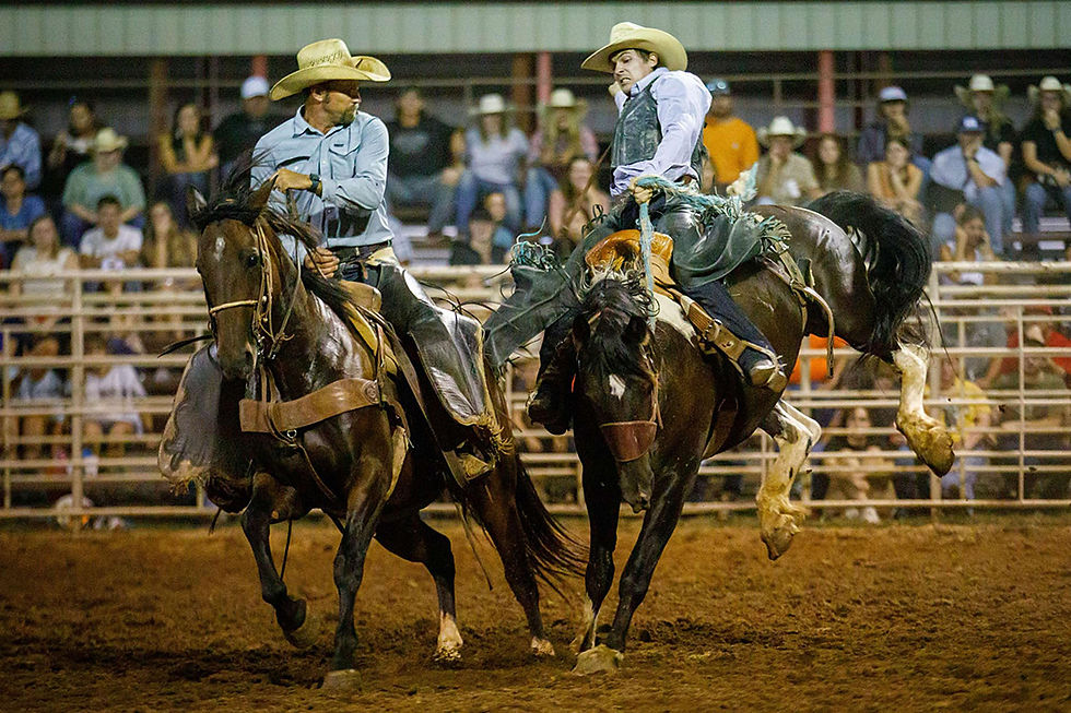 Cowboys compete in a team roping event at Great Salt Plains Stampede Rodeo.